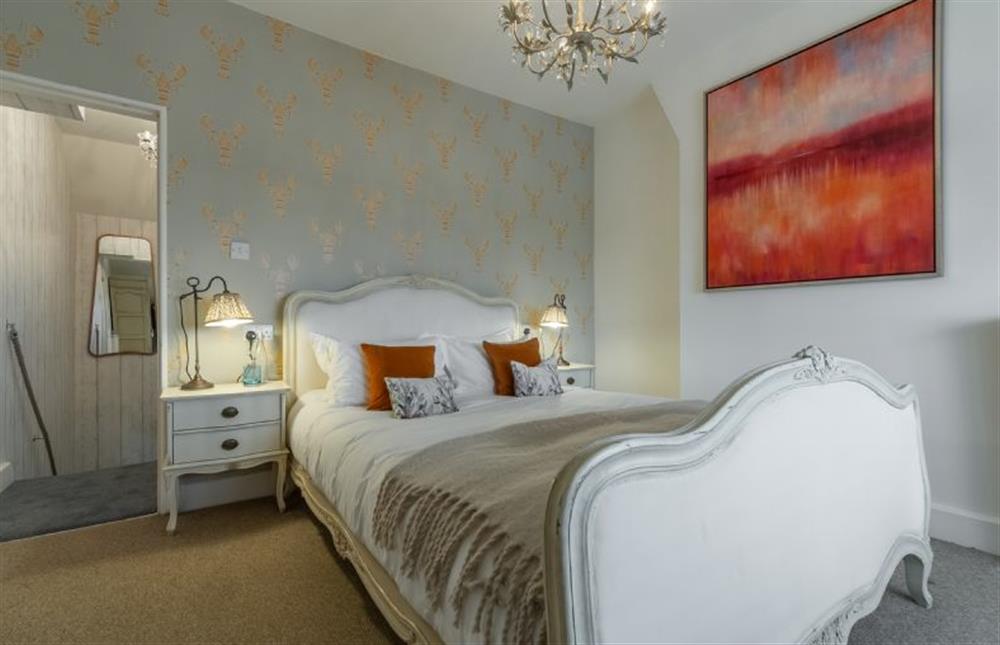 First floor: Master bedroom is beautifully furnished at Seagull Cottage, Hunstanton