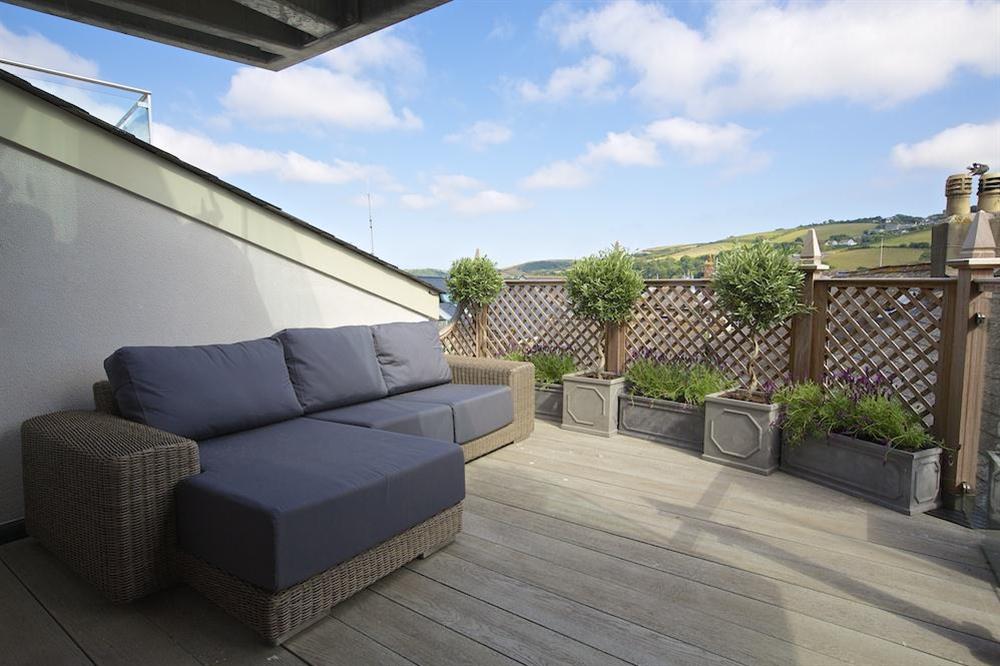 Decking with sofa accessed via the master bedroom at Seagull Cottage in , Salcombe