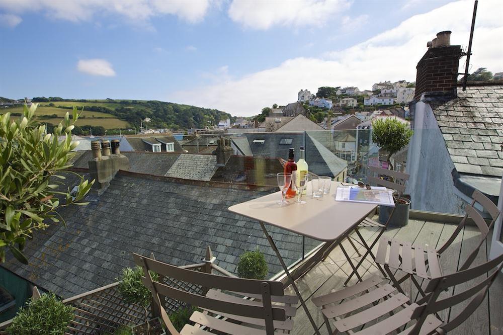 Decking with views over the roof tops towards the harbour at Seagull Cottage in , Salcombe