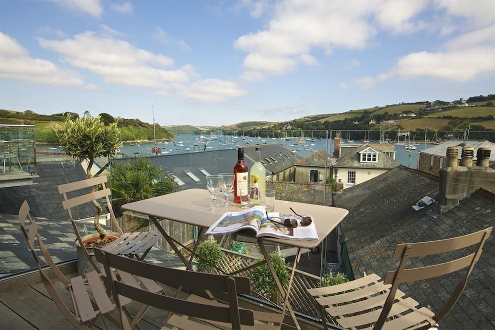 Enjoy drinks on the decking overlooking the harbour at Seagull Cottage in , Salcombe