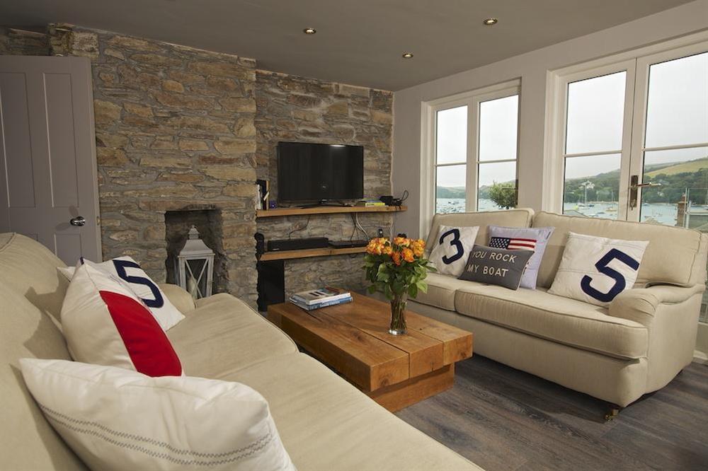 Lounge with views over the roof tops towards the harbour at Seagull Cottage in , Salcombe