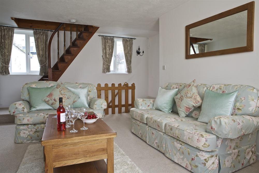 Comfortably sitting room furnished with two double sofas at Seagulls (Salcombe) in Fore Street, Salcombe