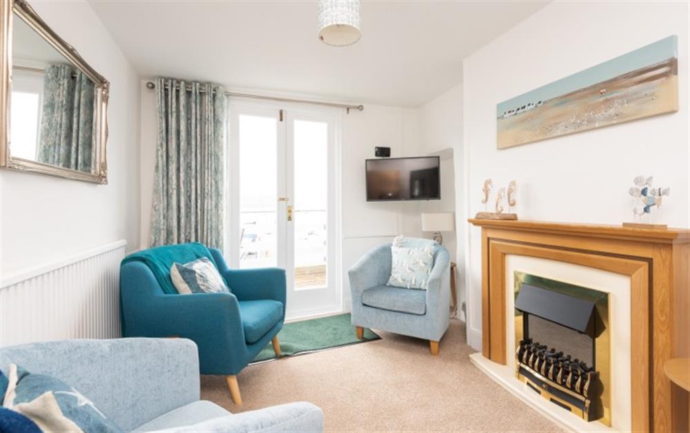 The lovely lounge with French doors onto the balcony. at Seahorse Cottage (30 Fore Street) in Salcombe