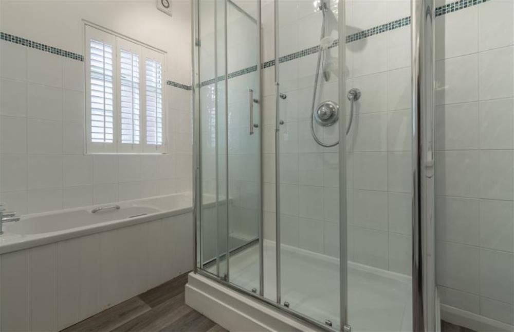 Ground Floor: Bathroom with bath and shower at Seahorses, Brancaster near Kings Lynn