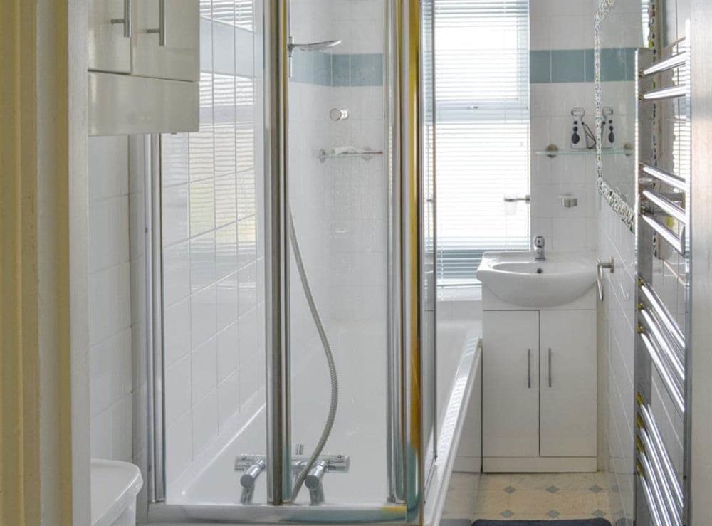 Bathroom with shower over bath at The Seahorses, 