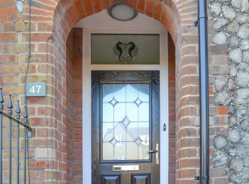 Delightful seahorse motif above the front door