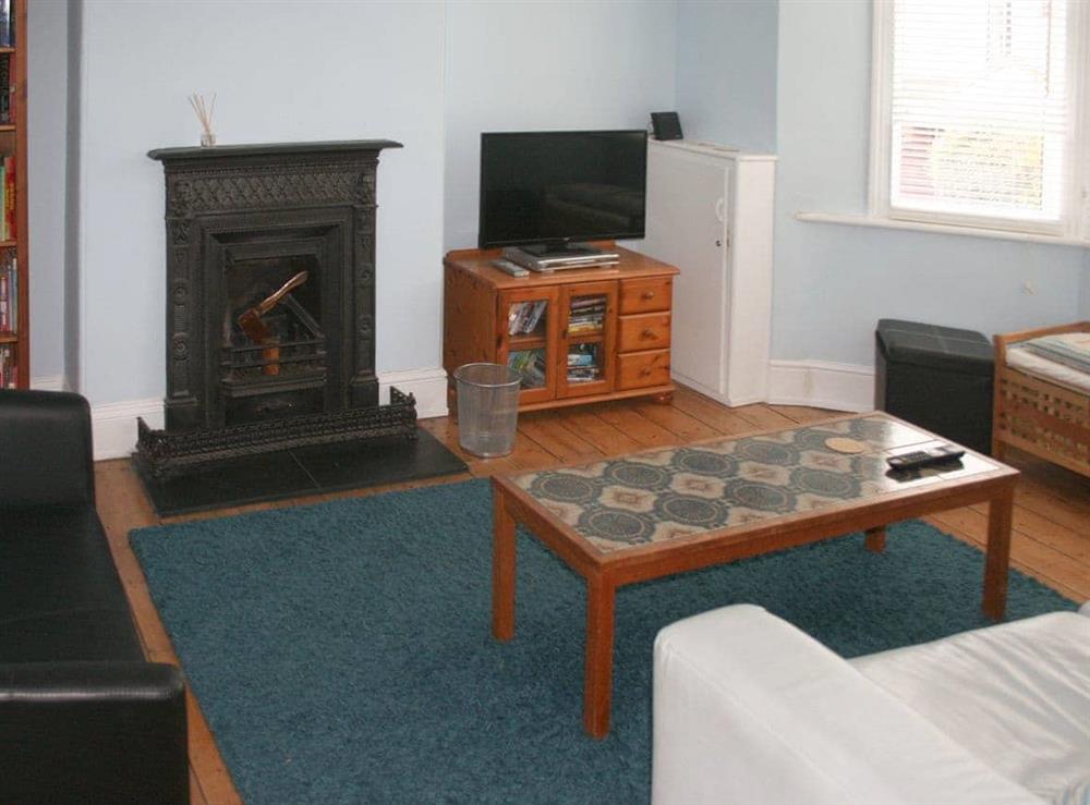 Living room with feature fireplace at The Seahorses, 