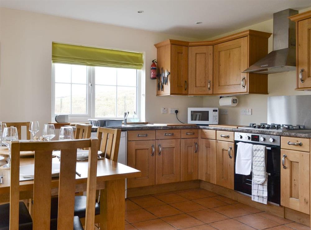 Fully equipped kitchen with dining area at Sealladh Breagh in Glenuachdarach, Isle Of Skye