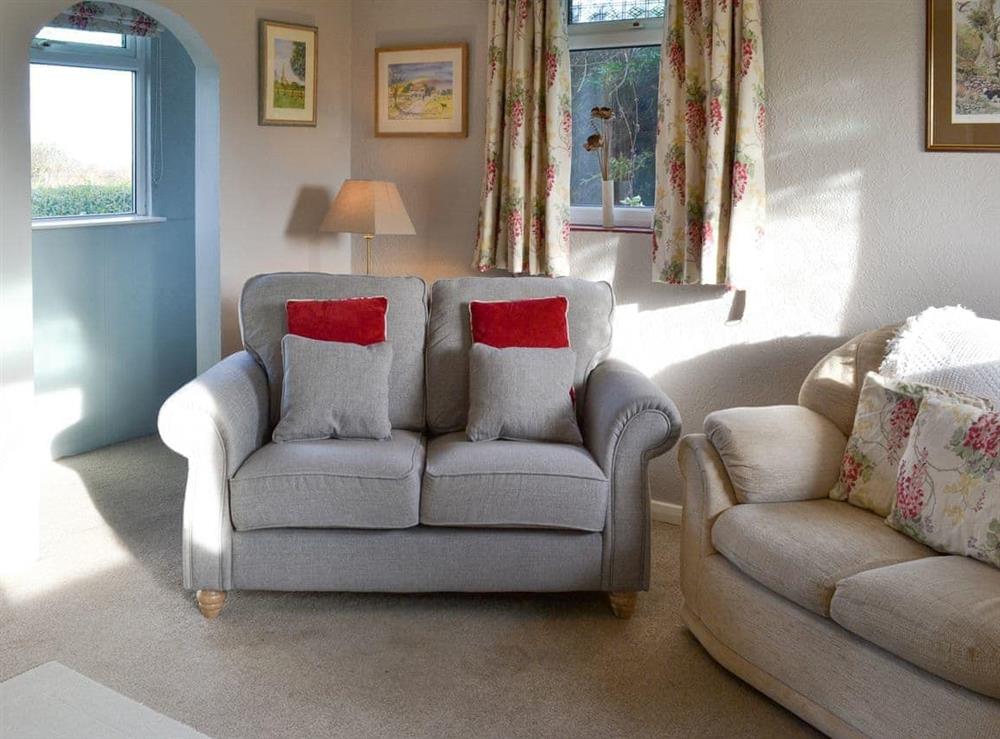 Comfortable seating within living area at Searchlight Cottage in Fraisthorpe, near Bridlington, North Humberside