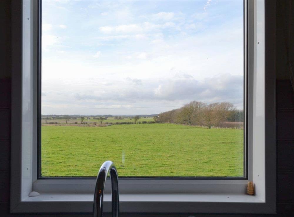 Peaceful rural view from the kitchen at Searchlight Cottage in Fraisthorpe, near Bridlington, North Humberside