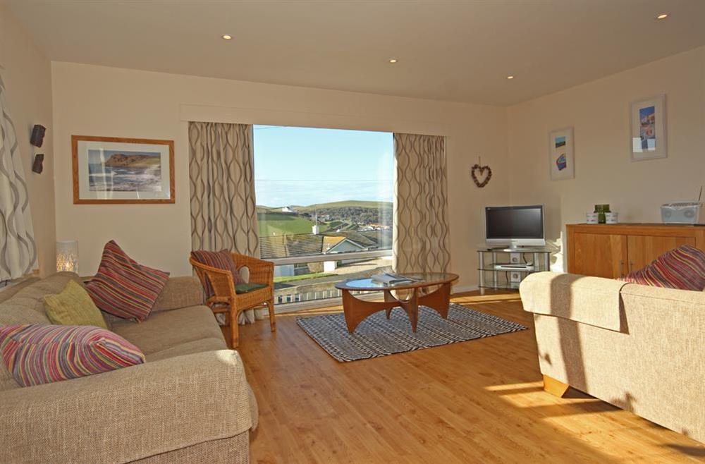 Comfortable lounge with new wooden flooring at Seascape (Hope Cove) in 23 Weymouth Park, Hope Cove