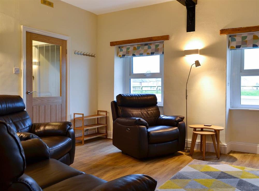 Cosy and comfortable living/dining area at Seascape Cottage in Allonby, near Maryport, Cumbria