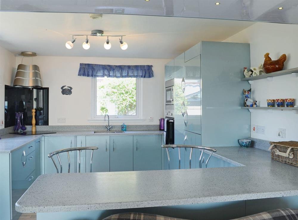 Bright modern kitchen with breakfast bar at Seascape in Hilton, near Tain, Highlands, Ross-Shire