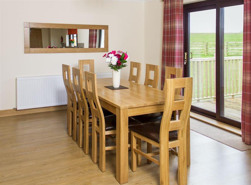 Large dining table with matching chairs for eight people