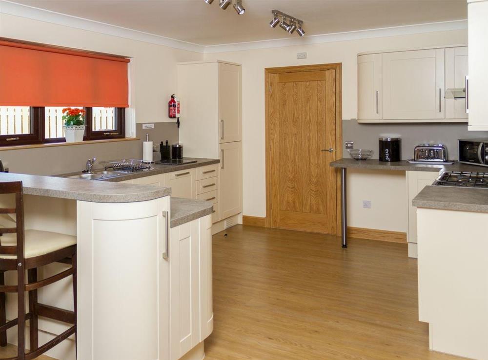 Modern fitted kitchen with breakfast bar at Seascape in Southerness, near Dumfries, Dumfriesshire