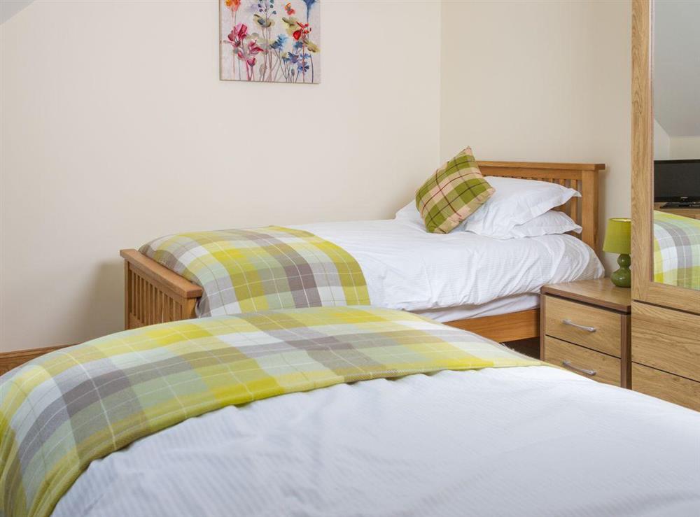 Twin bedroom with ample storage and flat-screen TV at Seascape in Southerness, near Dumfries, Dumfriesshire