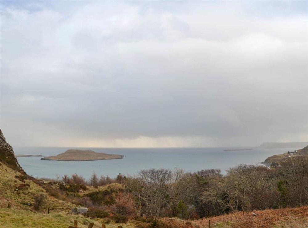 Views across open countryside towards the waters of Staffin Bay at Seascape in Staffin, Isle Of Skye
