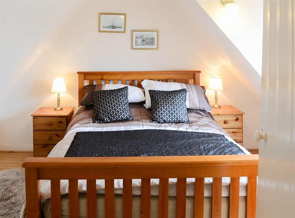 Warm and welcoming double bedroom at Seashell Cottage in Fishertown, near Nairn, Morayshire