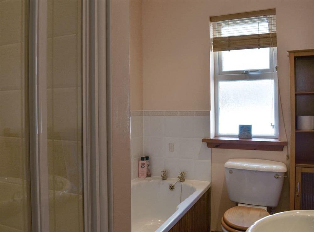 Bathroom with bath and shower cubicle at Seashore Retreat in Johnshaven, near Montrose, Aberdeenshire