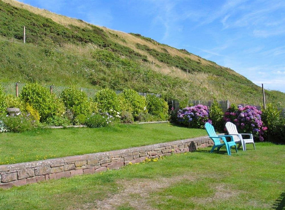 Large lawned garden at Seaside Cottage in Coulderton Beach, near St Bees, Cumbria