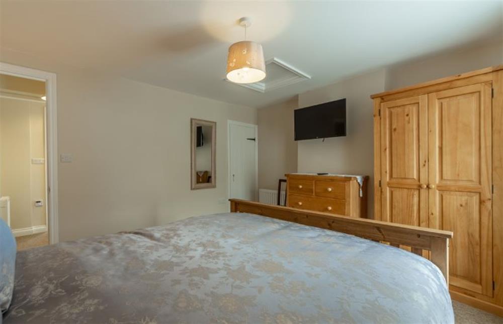 First Floor: Master bedroom with television at Seaside Cottage, Wells-next-the-Sea