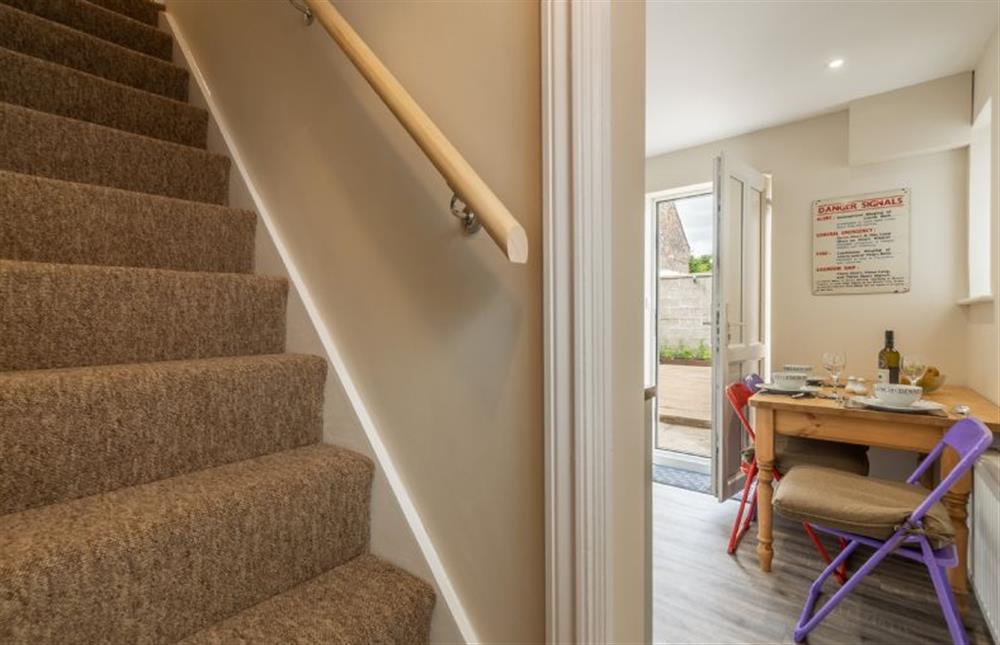 Ground Floor: Steep cottage stairs to the first floor at Seaside Cottage, Wells-next-the-Sea