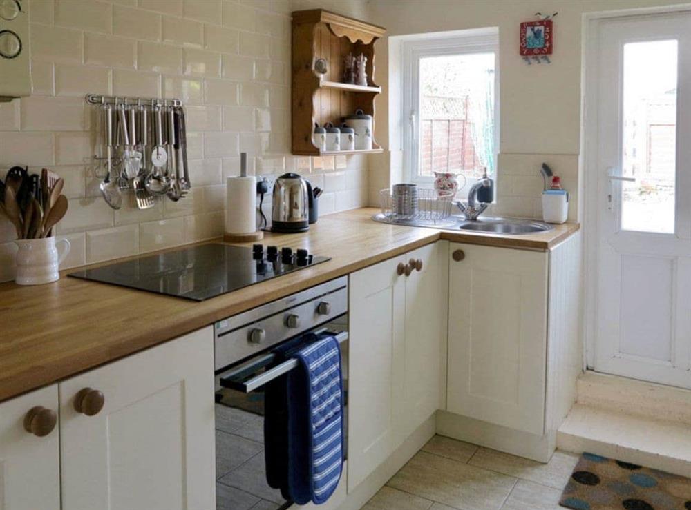 Well-equipped fitted kitchen at Jennys Cottage, 