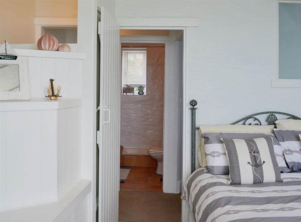 Double bedroom with en-suite shower room at Seaside Stories in Brixham, Devon
