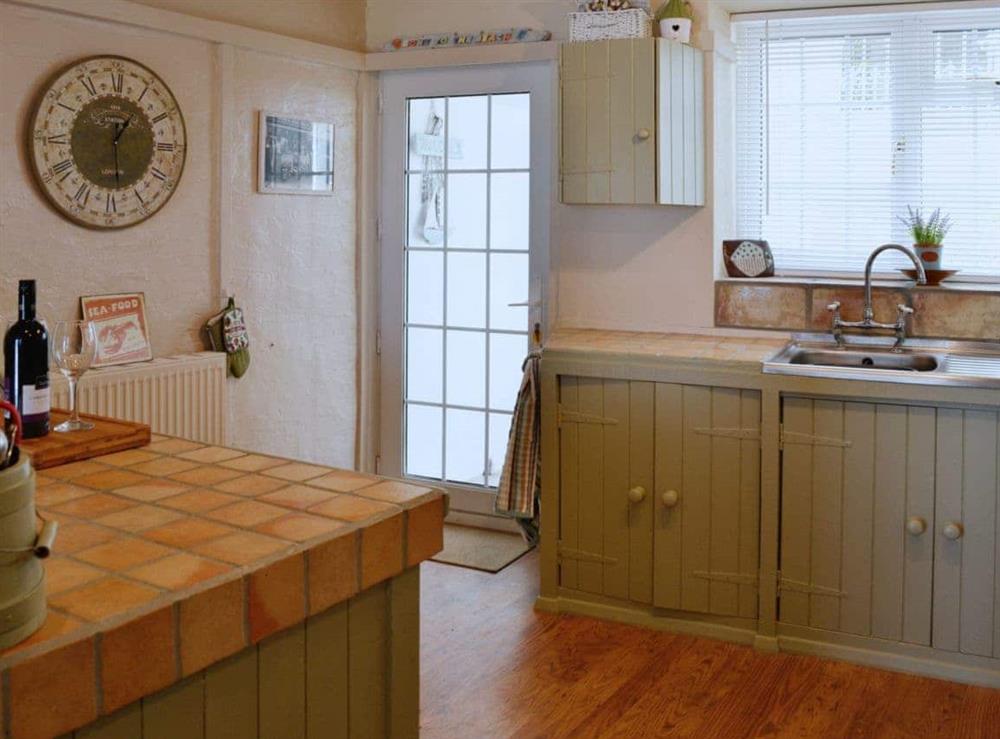 Kitchen/diner with direct access to the terrace at Seaside Stories in Brixham, Devon