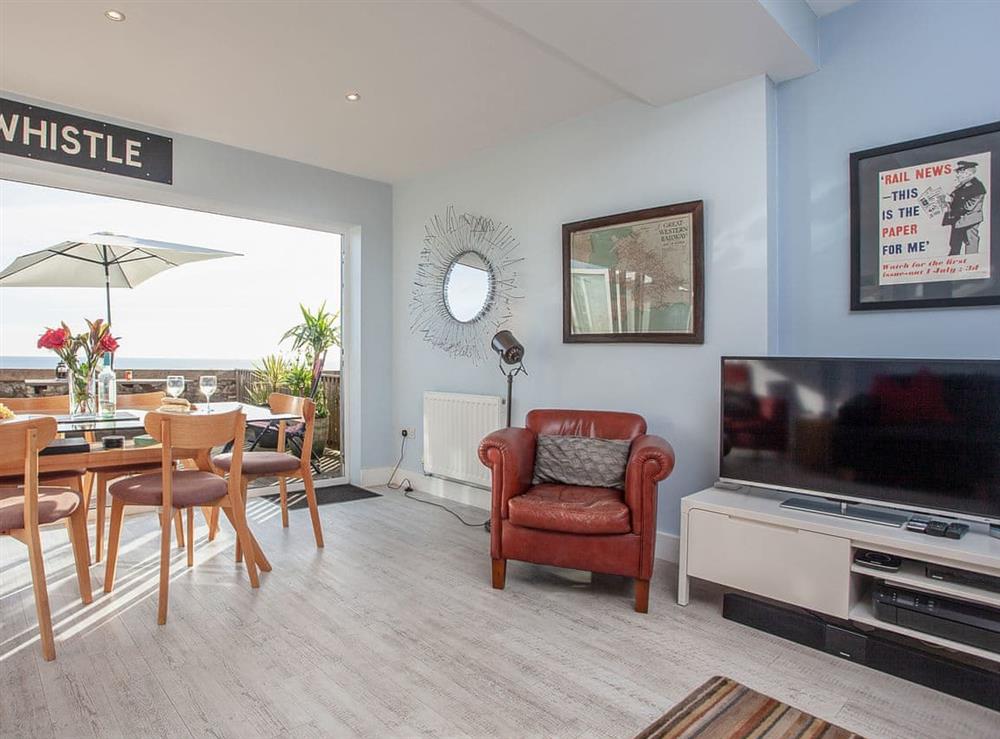 Open plan living space at Seaspray, Coastguard Cottages in Dawlish, Devon