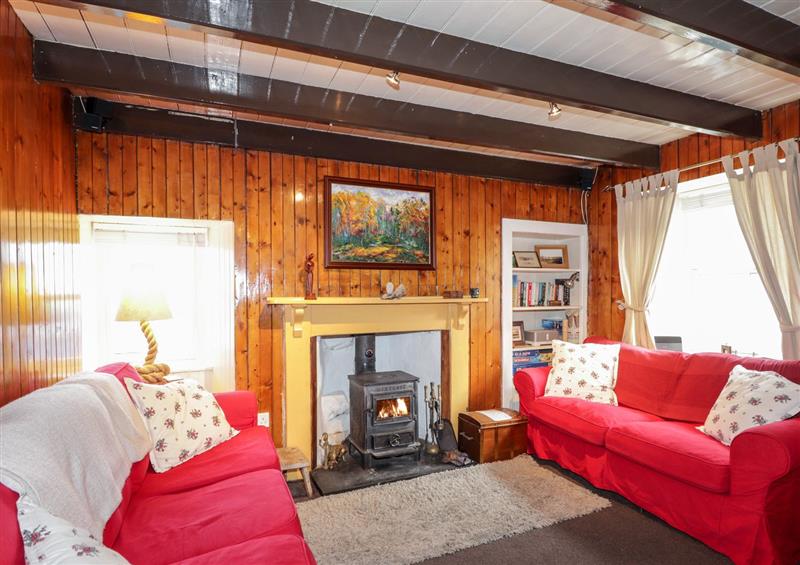 Relax in the living area at Seaspray Cottage, Whitehills