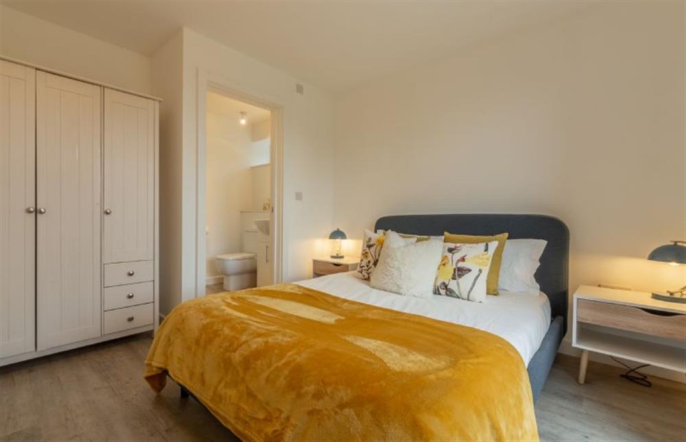 Ground floor: Bedroom two with door to en-suite at Seastiles, Salthouse near Holt
