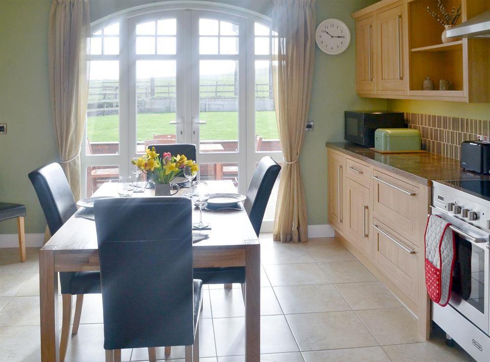 Kitchen/ dininer with patio doors leading to the garden at Seatoller in Kettleness near Whitby, North Yorkshire