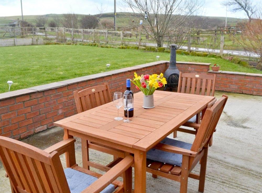 Outdoor furniture on patio at Seatoller in Kettleness near Whitby, North Yorkshire