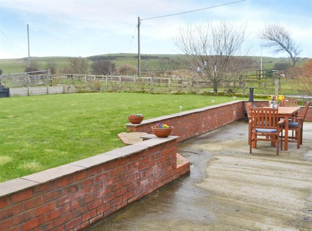 Patio and lawned garden at Seatoller in Kettleness near Whitby, North Yorkshire
