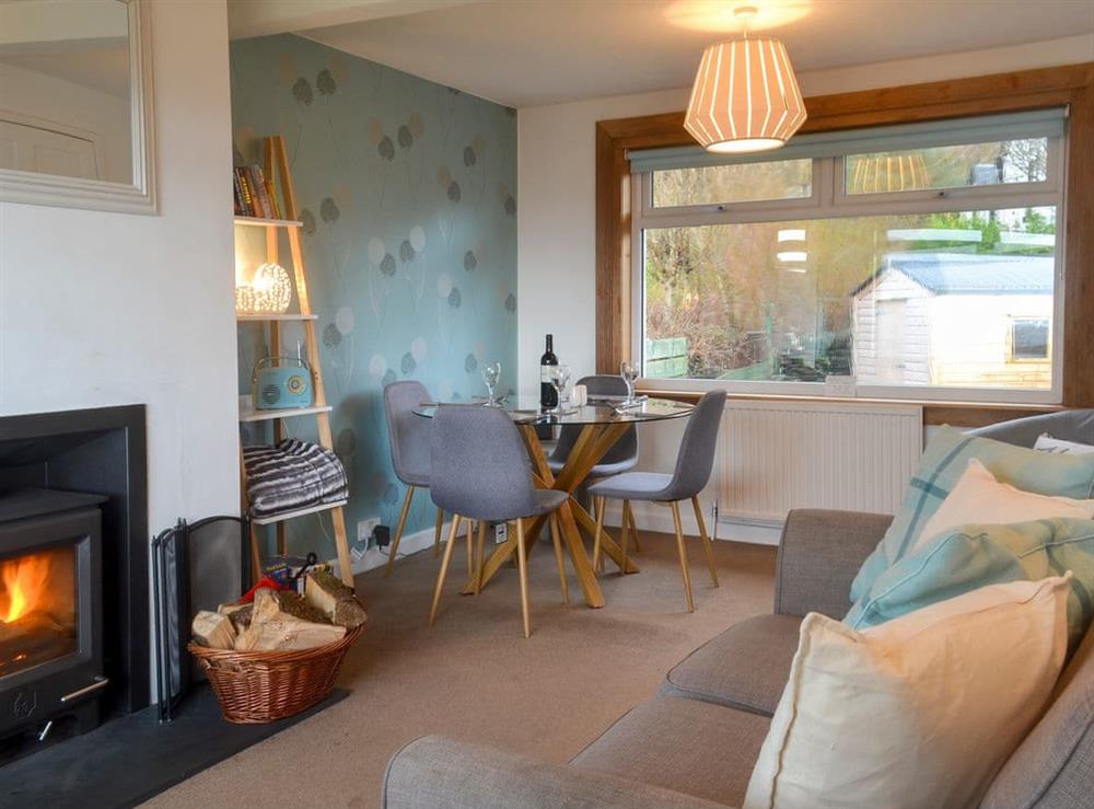 Cosy living/dining room at Seaview Cottage in Ellenabeich, near Oban, Argyll
