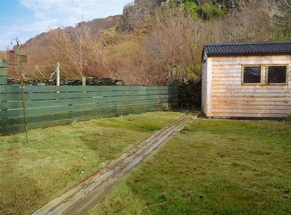 Small enclosed, lawned garden with garden furniture (photo 2) at Seaview Cottage in Ellenabeich, near Oban, Argyll