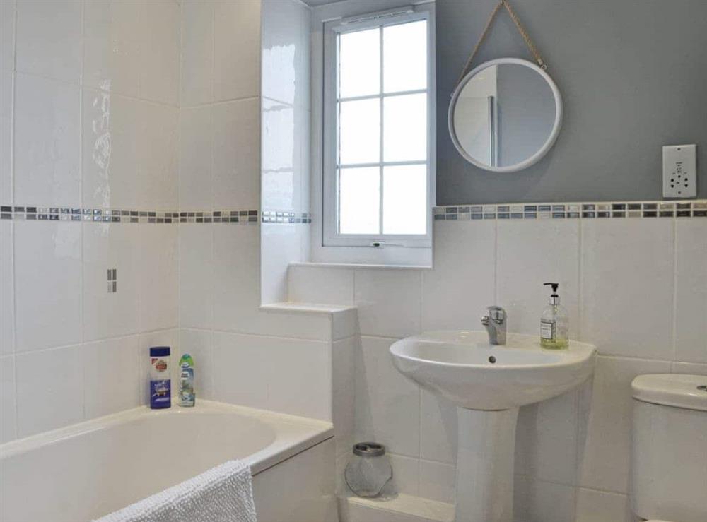 Bathroom with shower over bath at Seaview Cottage in Garlieston, Dumfries and Galloway