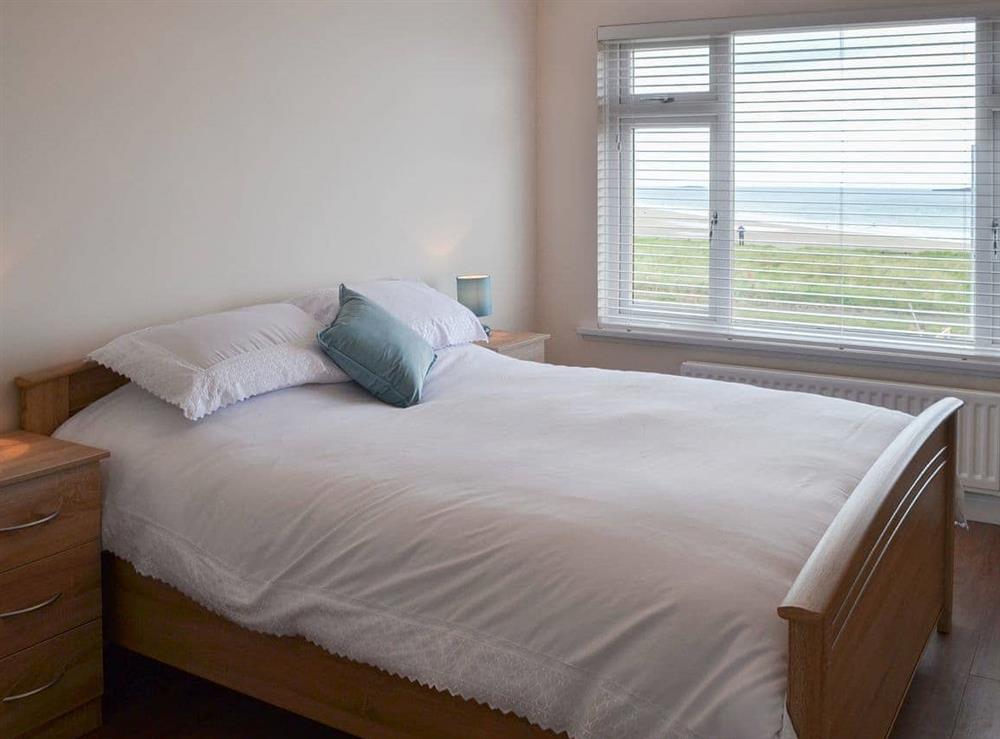 Romantic and inviting double bedroom with sea views at Seaview House in Seahouses, near Alnwick, Northumberland, England