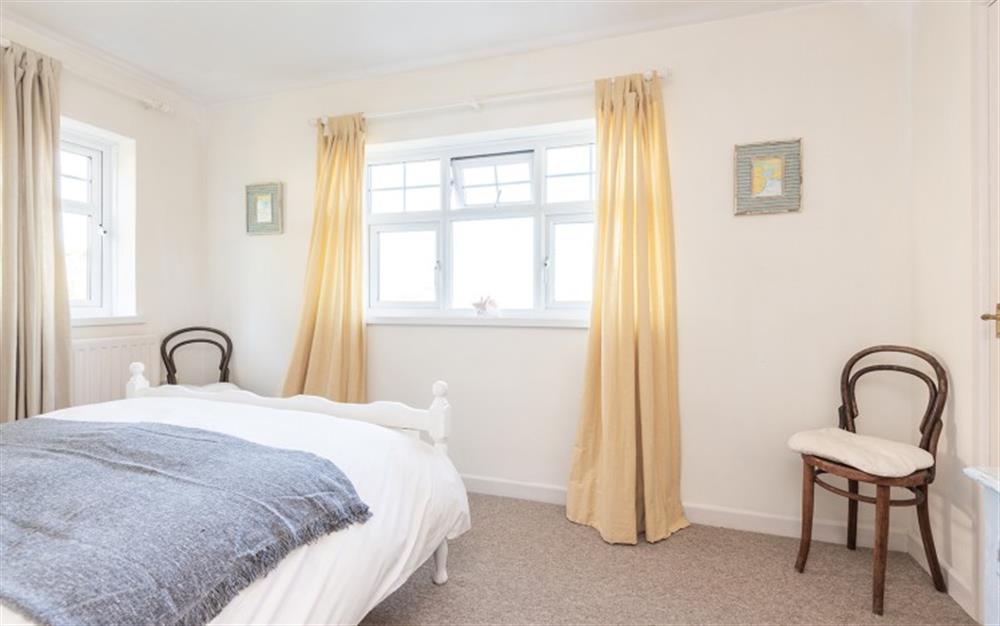 The bedroom with views across the village to the sea! at Seaview Nest in Stoke Fleming