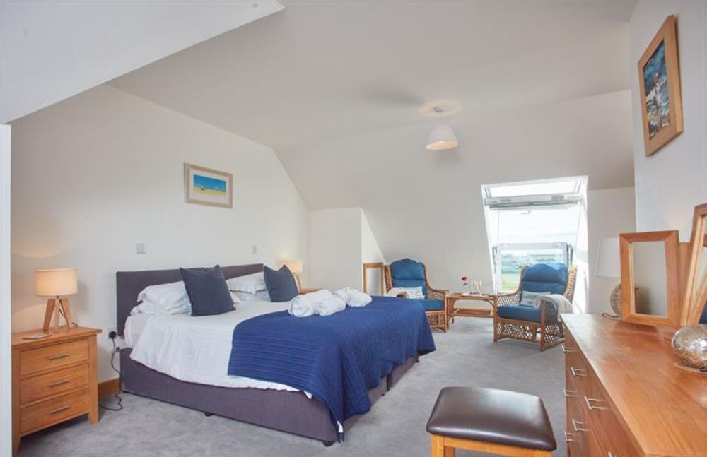 First floor: Bedroom one with super-king bed and en-suite bathroom at Seawynds, Trelights Near Port Isaac