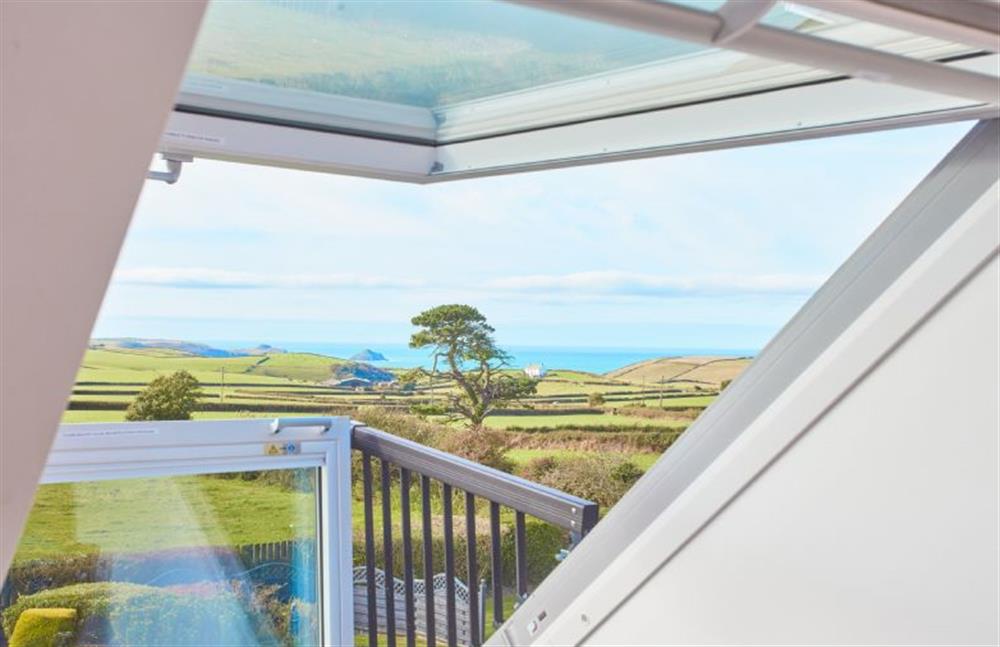 First floor: Bedroom one with views over the countryside and out to the sea at Seawynds, Trelights Near Port Isaac