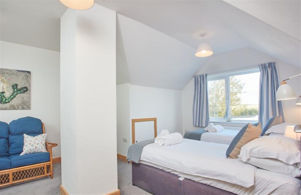 First floor: Bedroom two with twin single beds and en-suite at Seawynds, Trelights Near Port Isaac