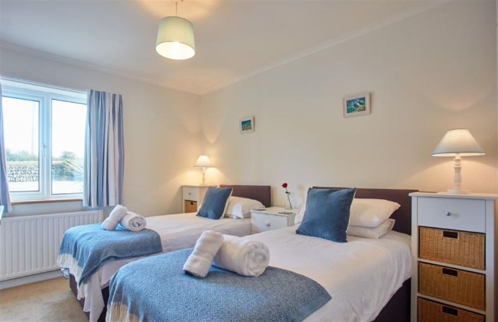 Ground floor: Bedroom five with a king-size bed and en-suite at Seawynds, Trelights Near Port Isaac
