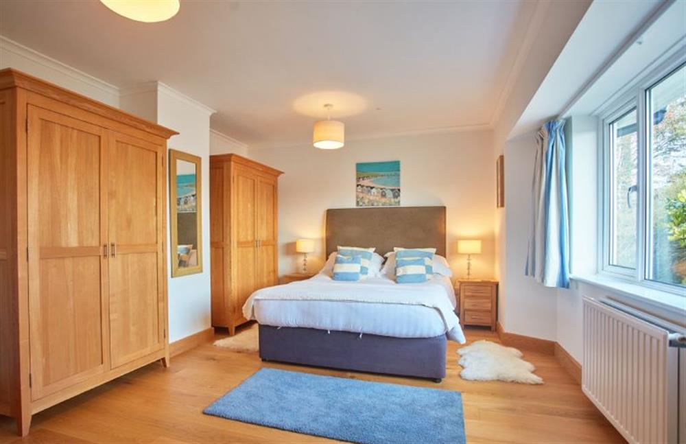 Ground floor: Bedroom three with a king-size bed at Seawynds, Trelights Near Port Isaac