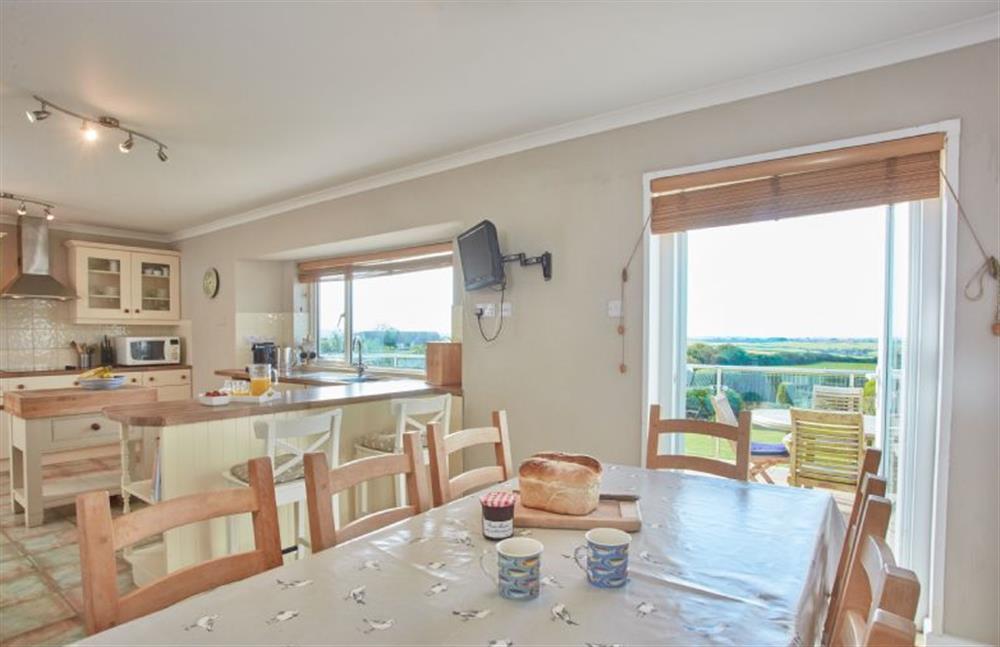 Ground floor: Dining area with table and seating for eight at Seawynds, Trelights Near Port Isaac