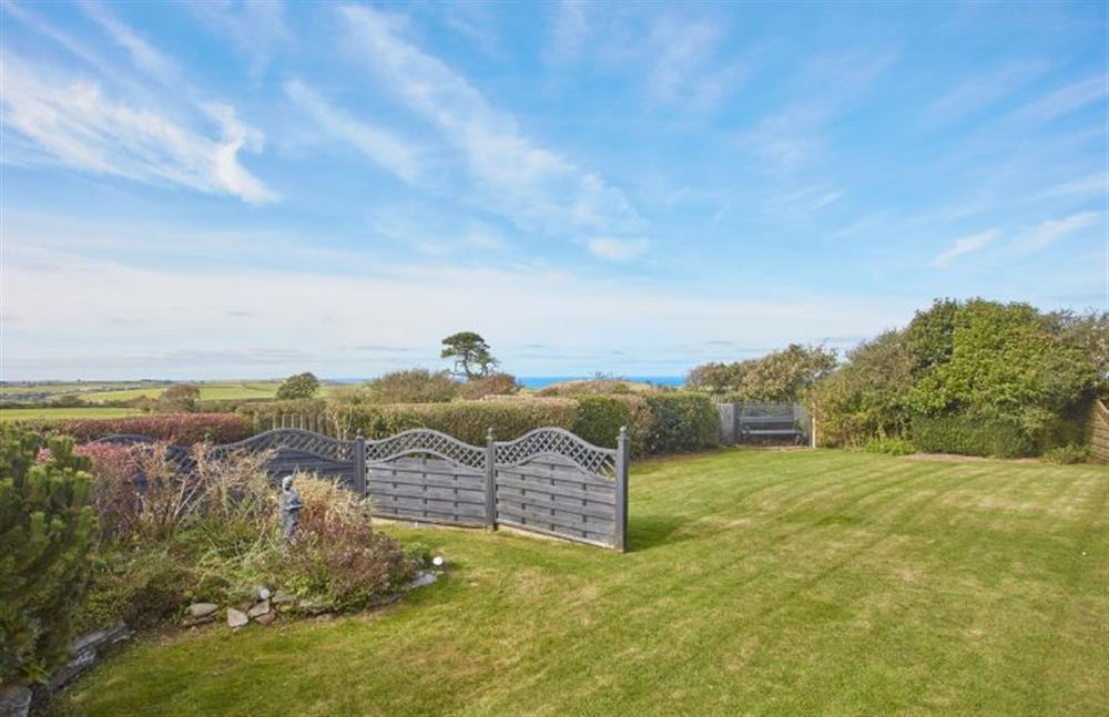 Large garden and patio area to the rear of property with sea views (photo 6) at Seawynds, Trelights Near Port Isaac