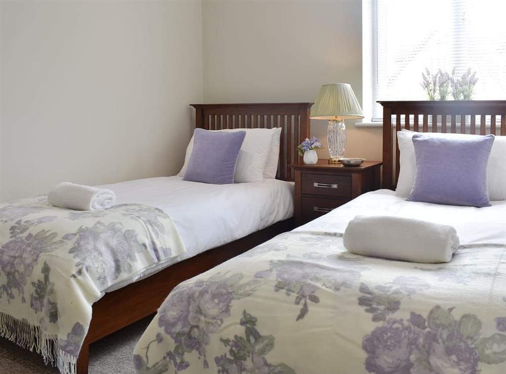 Comfy twin bedroom at Serendipity in West Parley, near Bournemouth, Dorset