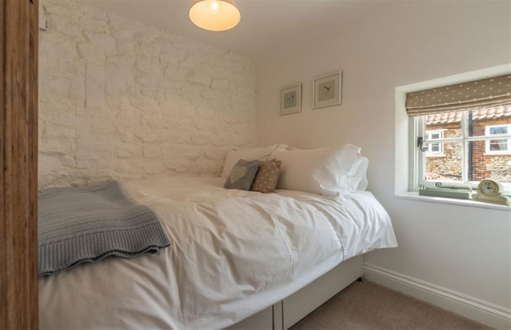 First floor: Bedroom two features a small double bed at Sextons Yard Cottage, Docking near Kings Lynn