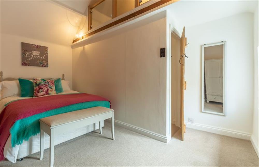 First floor: Master bedroom is made light and bright with its vaulted ceiling at Sextons Yard Cottage, Docking near Kings Lynn
